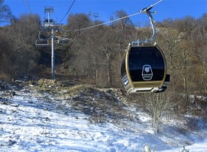McCrory and party descend from Sugar's mile-high summit in a glistening, Euro-style gondola.