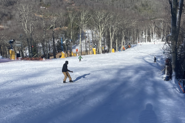 A snowboarder cruises down the hill at Cataloochee's opening day.